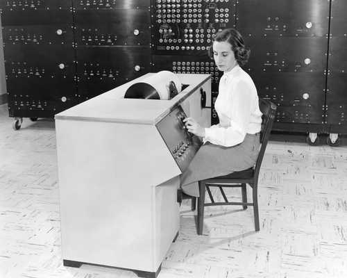 A woman operating a differential analyser